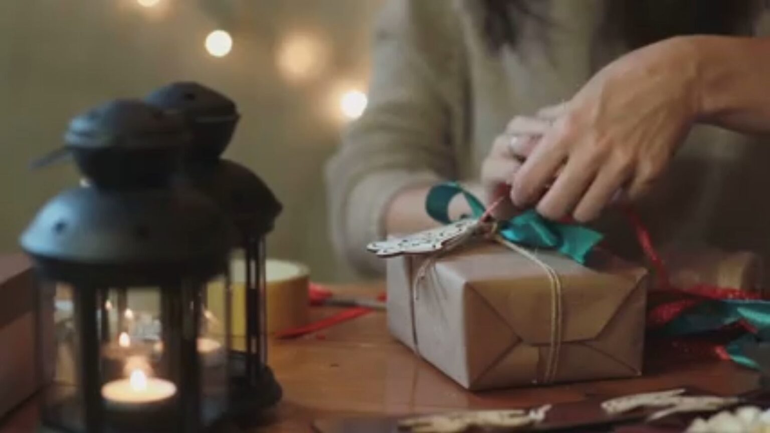 Wrapping a Gift With Brown Paper and a Red Bow