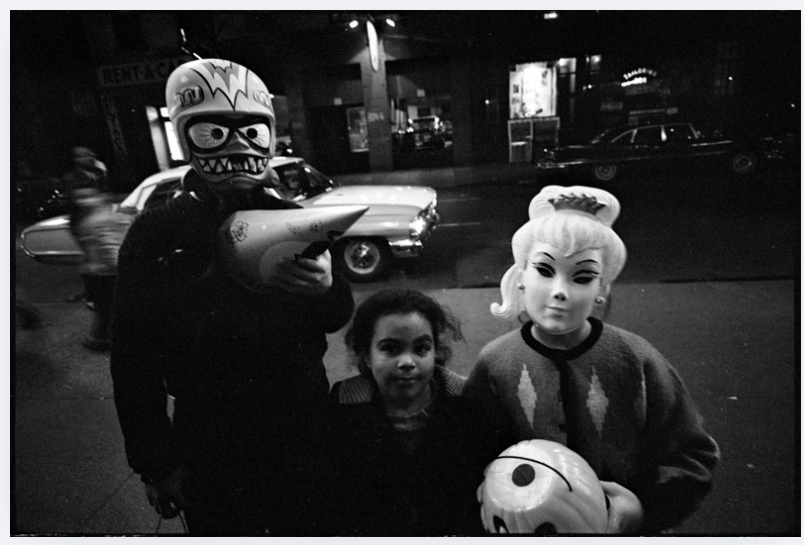 Children wearing Halloween masks on a New York street in 1964