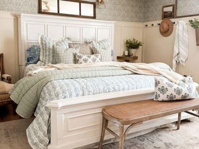 Cottage farmhouse quilt displayed in a bright rustic bedroom