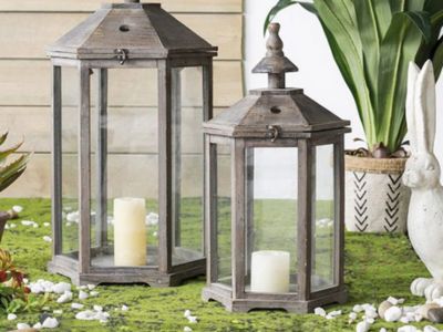 Garden gazebo candle lanterns displayed outdoors with greenery