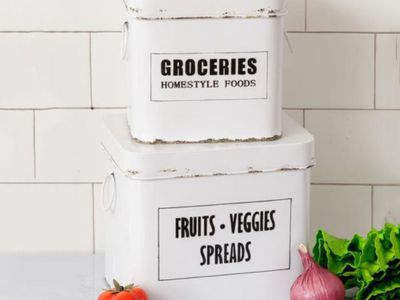 Lidded farmhouse kitchen canisters labeled groceries and fruits and vegetables