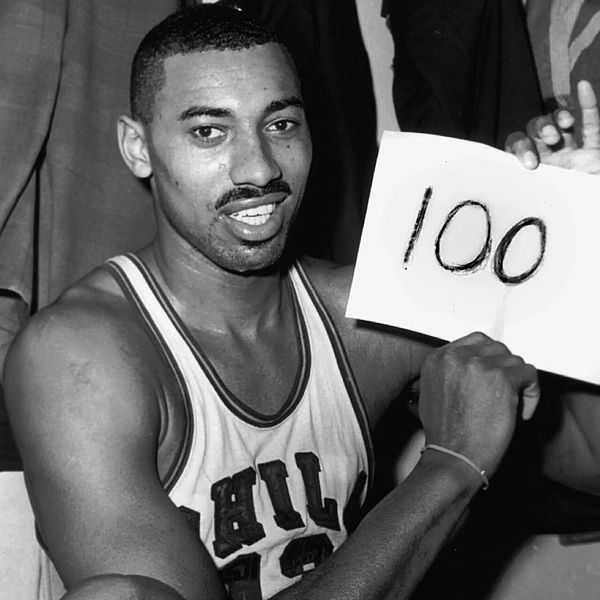 Wilt Chamberlain holding the 100 sign after his historic 1962 basketball game